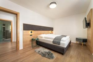 Ein Bett oder Betten in einem Zimmer der Unterkunft Seelos - Alpine Easy Flats