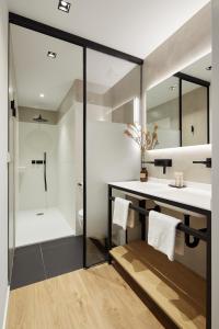 a bathroom with a sink and a shower at Jai Alai 54 by FeelFree Rentals in Donostia-San Sebastián +33 photos