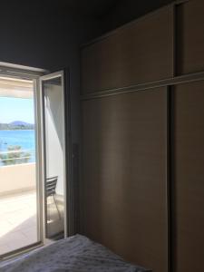 a bedroom with a bed and a view of the ocean at Galeb in Vodice