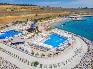 an aerial view of a resort with a pool at ODESSA, Город у Моря, Ривьера, ЖК Авторский in Fontanka