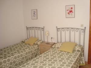 Cama o camas de una habitación en Apartamentos Sotavento Carboneras