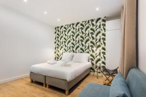 HSH Saint-Sauveur Luxury Apartment 8P-3BR tesisinde bir odada yatak veya yataklar