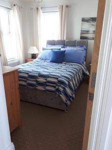 Кровать или кровати в номере Rock Quay