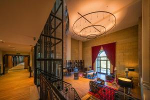 a large room with a clock on the wall at Catalonia Donosti in Donostia-San Sebastián