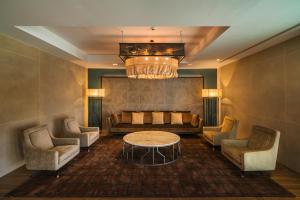 a living room with a couch and a table and chairs at Catalonia Donosti in Donostia-San Sebastián