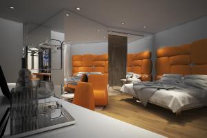 a hotel room with two beds and a television at The Street Milano Duomo | a Design Boutique Hotel in Milan