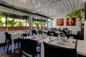 Reštaurácia alebo iné gastronomické zariadenie v ubytovaní Hotel Rinascimento - Gruppo Trevi Hotels