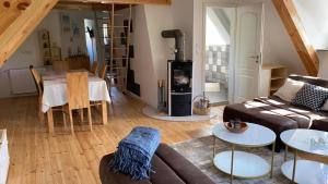 a living room with a couch and a table at Gästehaus Kamminke in Kamminke