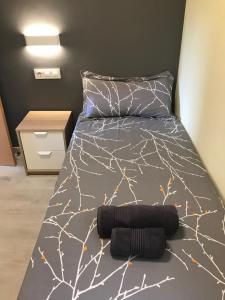 Postel nebo postele na pokoji v ubytování Cerdanyola centro