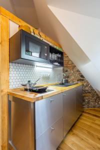 Kuchyň nebo kuchyňský kout v ubytování Apartments No 126 Loket
