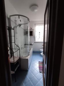 a bathroom with a tub and a toilet and a sink at A me ca picita in Stella +19 photos