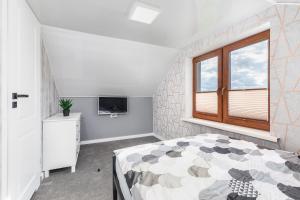 Telewizja i/lub zestaw kina domowego w obiekcie Przystań 44