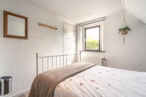 Postel nebo postele na pokoji v ubytování Vakantiehuis Vieverdwas - Yerseke