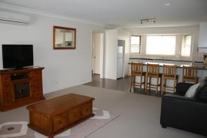 a living room with a couch and a coffee table at Breakaway Apartments in Cowra