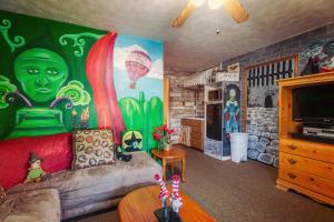 a living room with a painting on the wall at Simmer Motel in Wamego