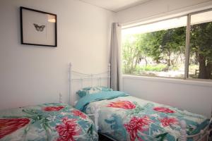 a bedroom with two beds next to a window at Carawatha in Blackheath
