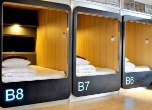 Postel nebo postele na pokoji v ubytování MyBed Ratchada