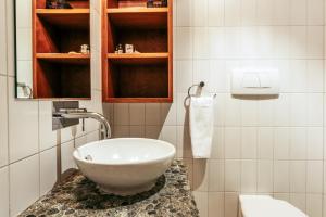 A bathroom at Sanctuary On The Beach - Onetangi by Waiheke Unlimited