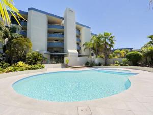 a large swimming pool in front of a building at Florentine 3, 11 Columbia Cl - Air Con and Sensational Waterviews in Nelson Bay