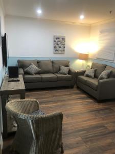 a living room with a couch and a table at Vacation Bliss LLC in Hilton Head Island