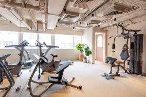 a gym with cardio machines and treadmills at the Figo in Hong Kong