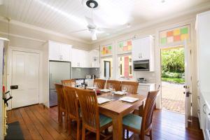 a kitchen and dining room with a table and chairs at Heathmont in Blackheath