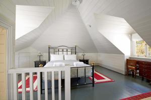 a bedroom with a bed in a attic at Heathmont in Blackheath