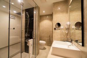 a bathroom with a sink and a shower and a toilet at D&F BOUTIQUE HOTEL SEREMBAN 2 in Seremban +19 photos