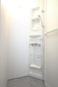 a white bathroom with a shower and a sink at Fuji Time Traveler 玉手箱 in Fujikawaguchiko +58 photos