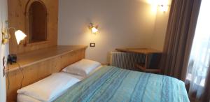 Postel nebo postele na pokoji v ubytování Hotel Villa Fosine