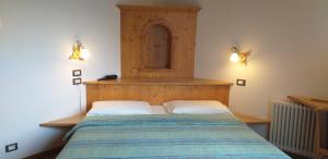 Postel nebo postele na pokoji v ubytování Hotel Villa Fosine