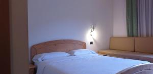 Postel nebo postele na pokoji v ubytování Hotel Villa Fosine