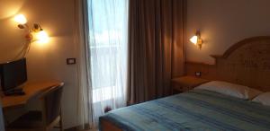 Postel nebo postele na pokoji v ubytování Hotel Villa Fosine