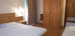 Postel nebo postele na pokoji v ubytování Hotel Villa Fosine
