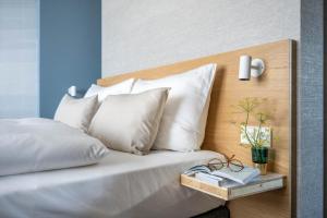 Katil atau katil-katil dalam bilik di Hotel Maier