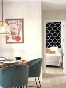 Postel nebo postele na pokoji v ubytování Apartamentos Magna Sevilla
