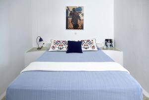A bed or beds in a room at Altana Heritage Suites