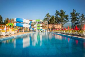 a large swimming pool with a water slide at SPA Hotel Elbrus in Velingrad