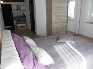Postel nebo postele na pokoji v ubytování Apartment-rooms Preka
