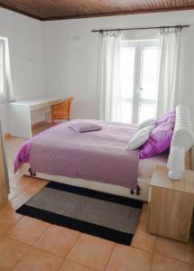 Postel nebo postele na pokoji v ubytování Apartment-rooms Preka