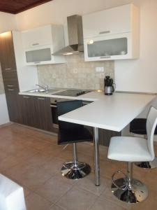 Kuchyň nebo kuchyňský kout v ubytování Apartment-rooms Preka