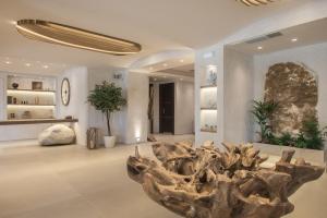 a museum with a large tree stump in the middle of a room at GARDELLI RESORT in Laganas