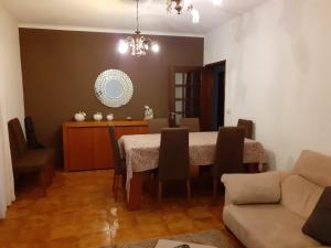 a dining room with a table and a couch at Casa Marciana in Geres