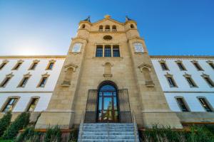a building with a clock tower on top of it at Catalonia Donosti in Donostia-San Sebastián
