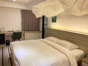 Letto o letti in una camera di RF Hotel - Zhongxiao