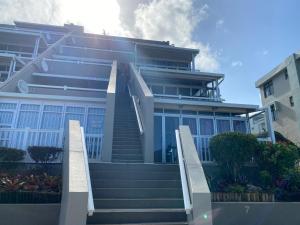 a large building with stairs in front of it at Playa Del Mar 12 in Margate
