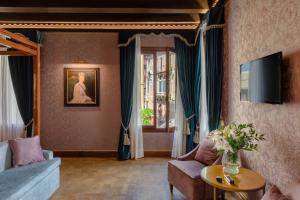 TV a/nebo společenská místnost v ubytování Hotel Donà Palace