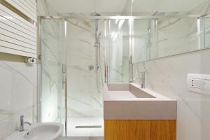 a bathroom with a sink and a shower at Monti Panisperna suites in Rome