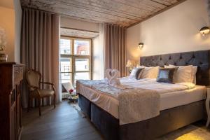 Postel nebo postele na pokoji v ubytování Rataskaevu Boutique - 7 Unique Apartments