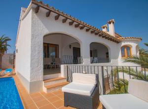 a villa with a swimming pool and a house at Villa Alexia - Plusholidays in Calpe